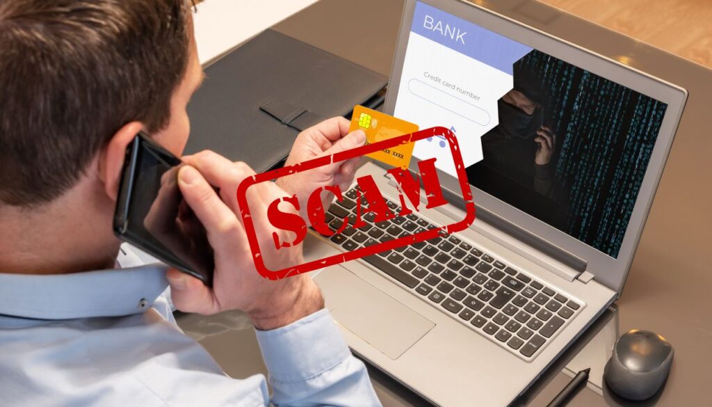 image contains a man checking with his bank on a potential scam